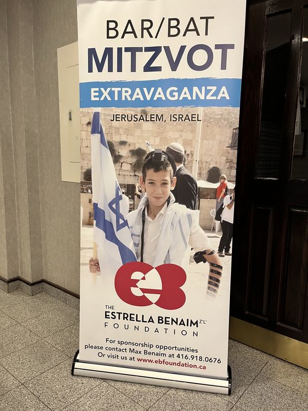 Bar Mitzvah boy at the Kotel with Israeli flag and talit